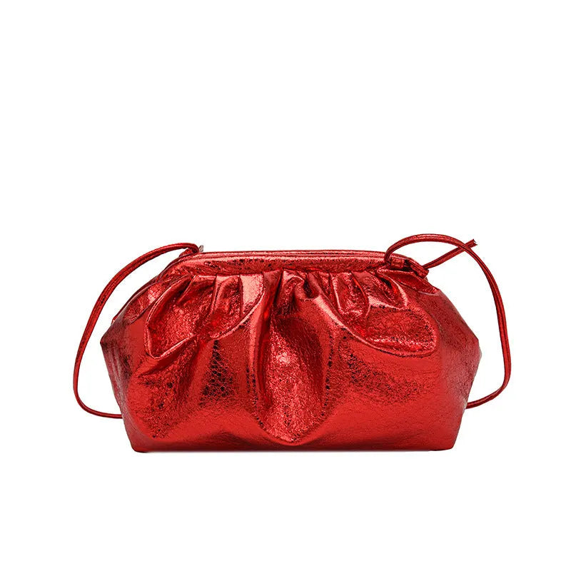 Shell-shaped shoulder crossbody bag with hair clip closure in rose red colour showing interior organisation compartments