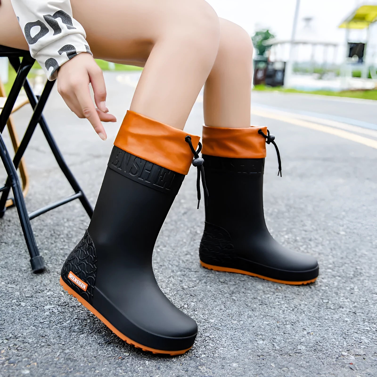 Women's PVC rain boots with non-slip soles in apricot, black, brown, or pink colours