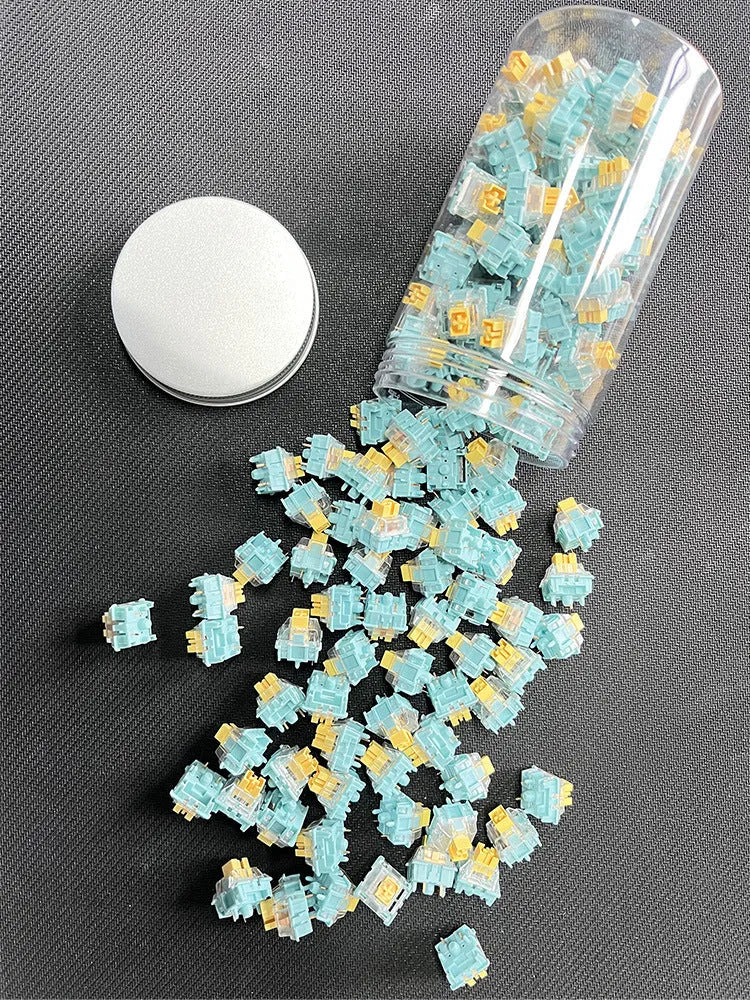 36 Sea Salt Lemon PRO Mute mechanical keyboard switches with transparent housings on a white background.