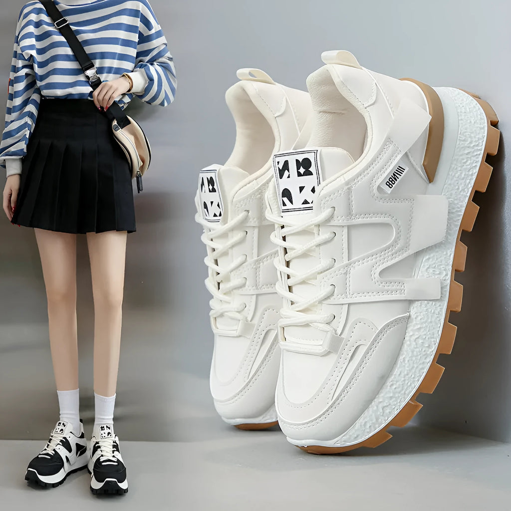 Low-top lace-up sneakers with artificial PU upper and rubber sole in black or white colour