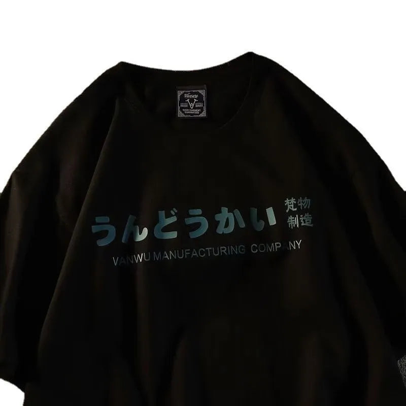 Plain black cotton short sleeve t-shirt laid flat, showing loose fit and crew neck design.