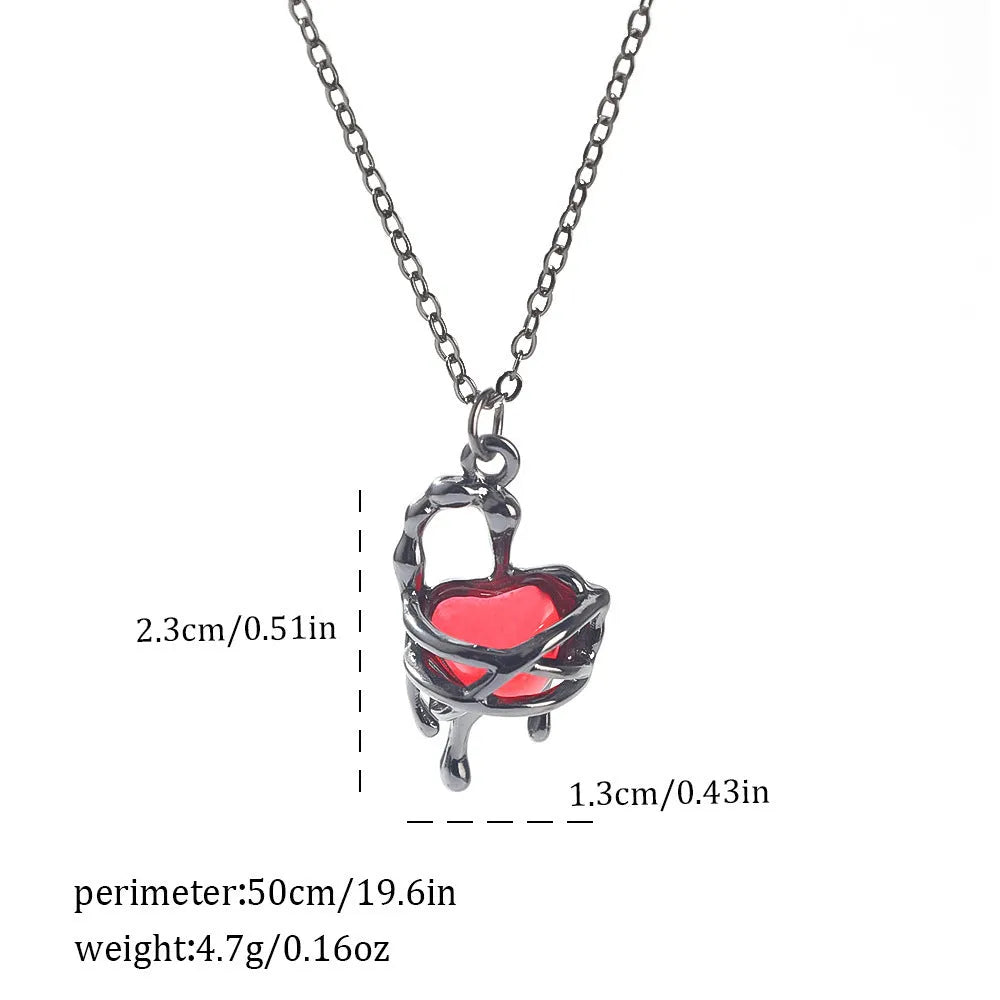 Gothic Halloween necklace with spider and bat alloy pendant on a chain.