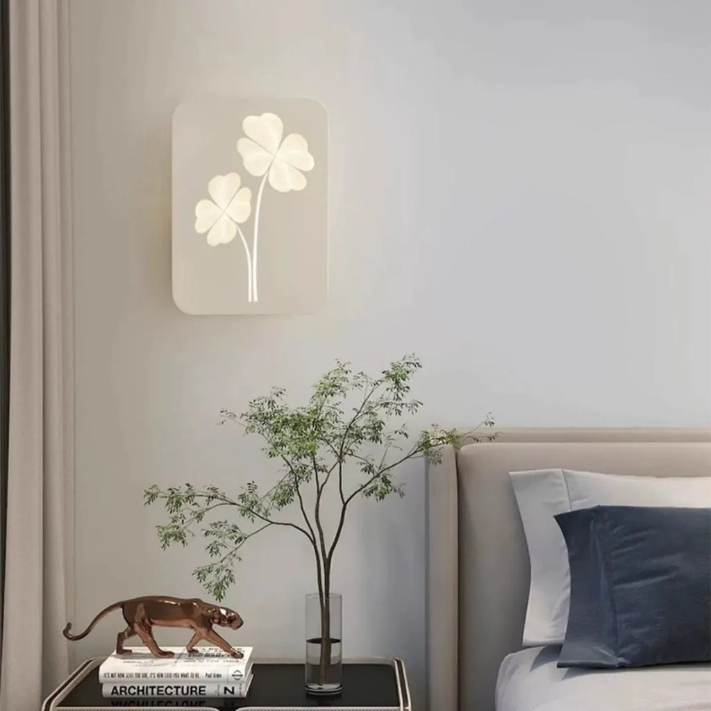 Modern bedside lamp with acrylic shade and iron base showing tricolour LED light and decorative heart design.