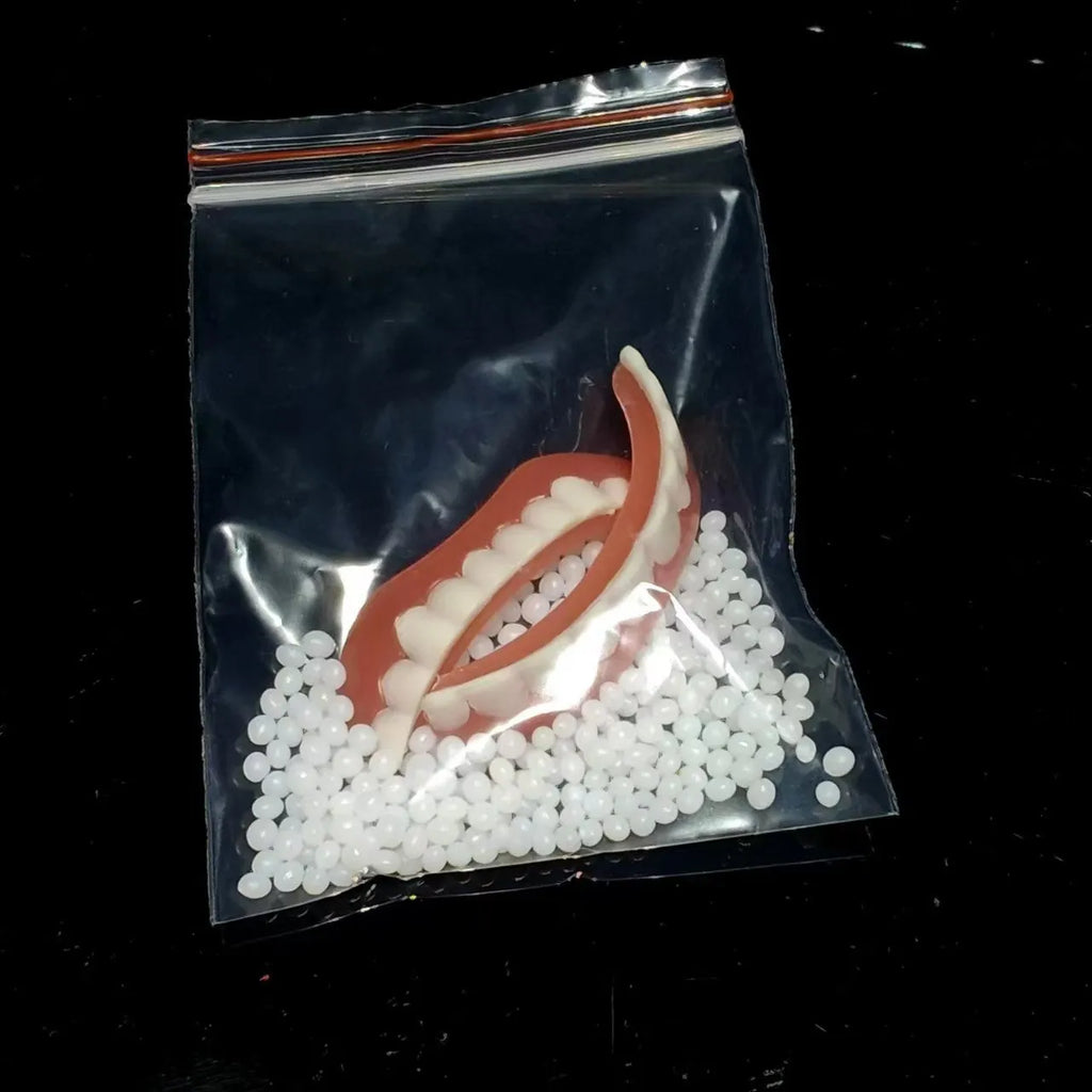Silicone simulation dentures set showing upper and lower artificial teeth for dental training