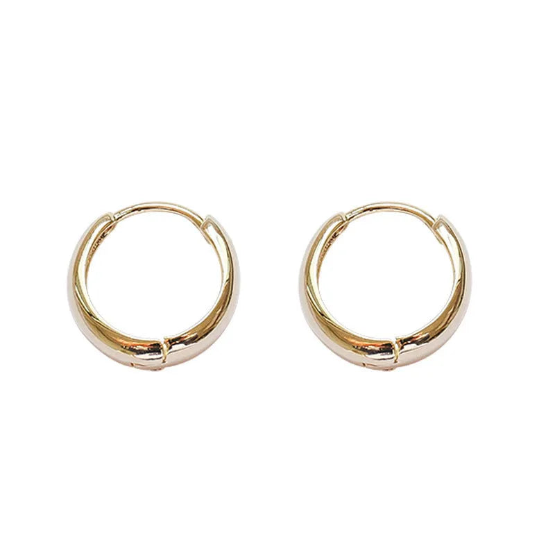 Women's geometric water drop earrings in gold or silver with retro minimalist circular design