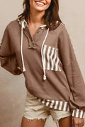 Straw yellow hoodie with waffle texture fabric, striped patchwork panels, button neck, and drawstring waist.
