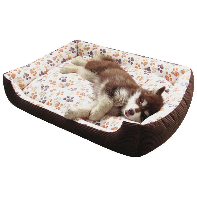 Beige plush sofa-style pet bed for a small dog, showing bolstered sides and padded construction.