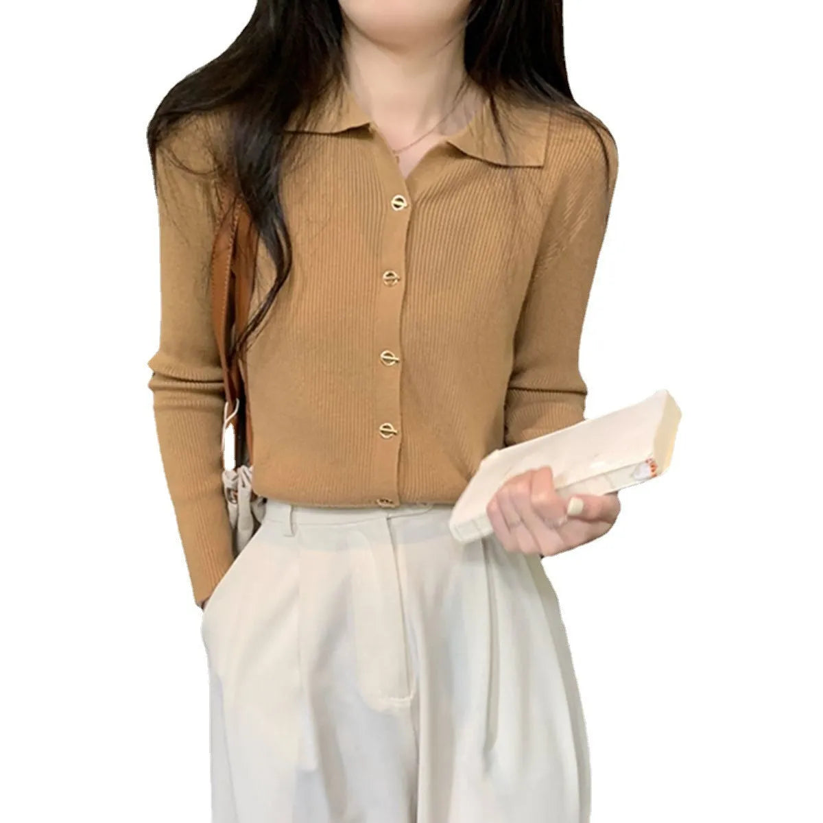 Beige viscose knitted cardigan with long sleeves displayed as bottoming top