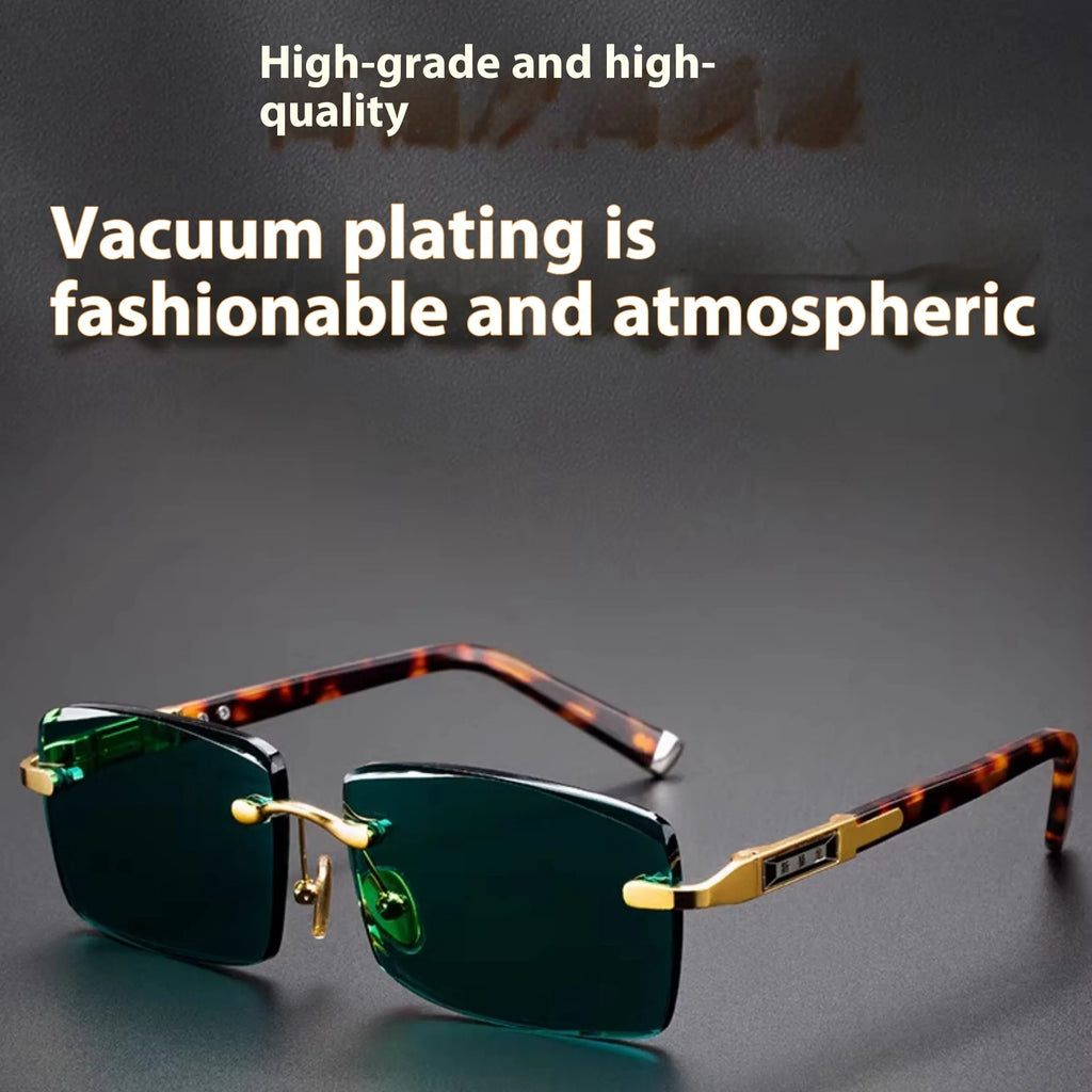 Dark green frameless crystal sunglasses with case and cleaning cloth on a solid background.