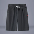 Solid colour cotton linen cropped summer pants with a drawstring waist on a hanger.