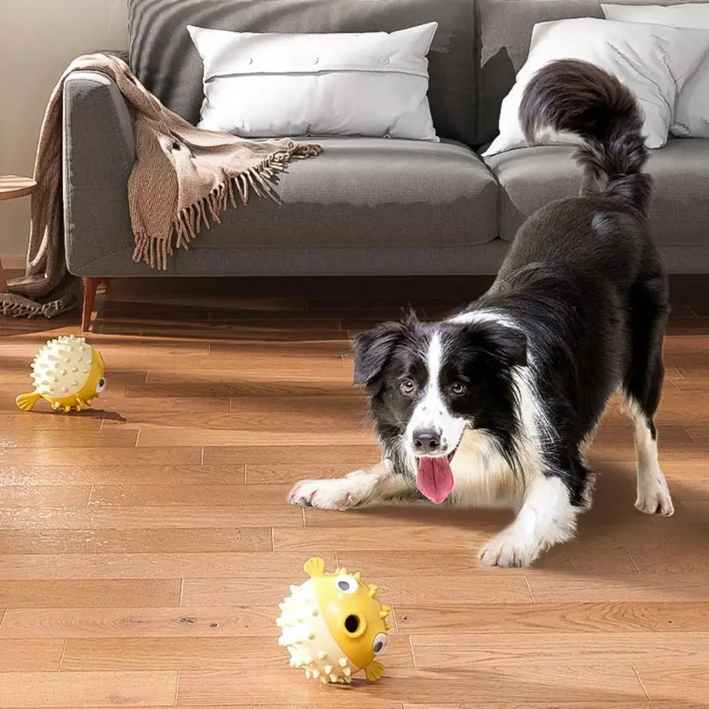 Yellow vinyl fish-shaped dog chew toy with textured surface for dental care