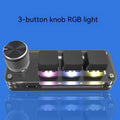 Compact black USB mini keyboard with RGB backlit keys labelled Copy and Paste on a desk.