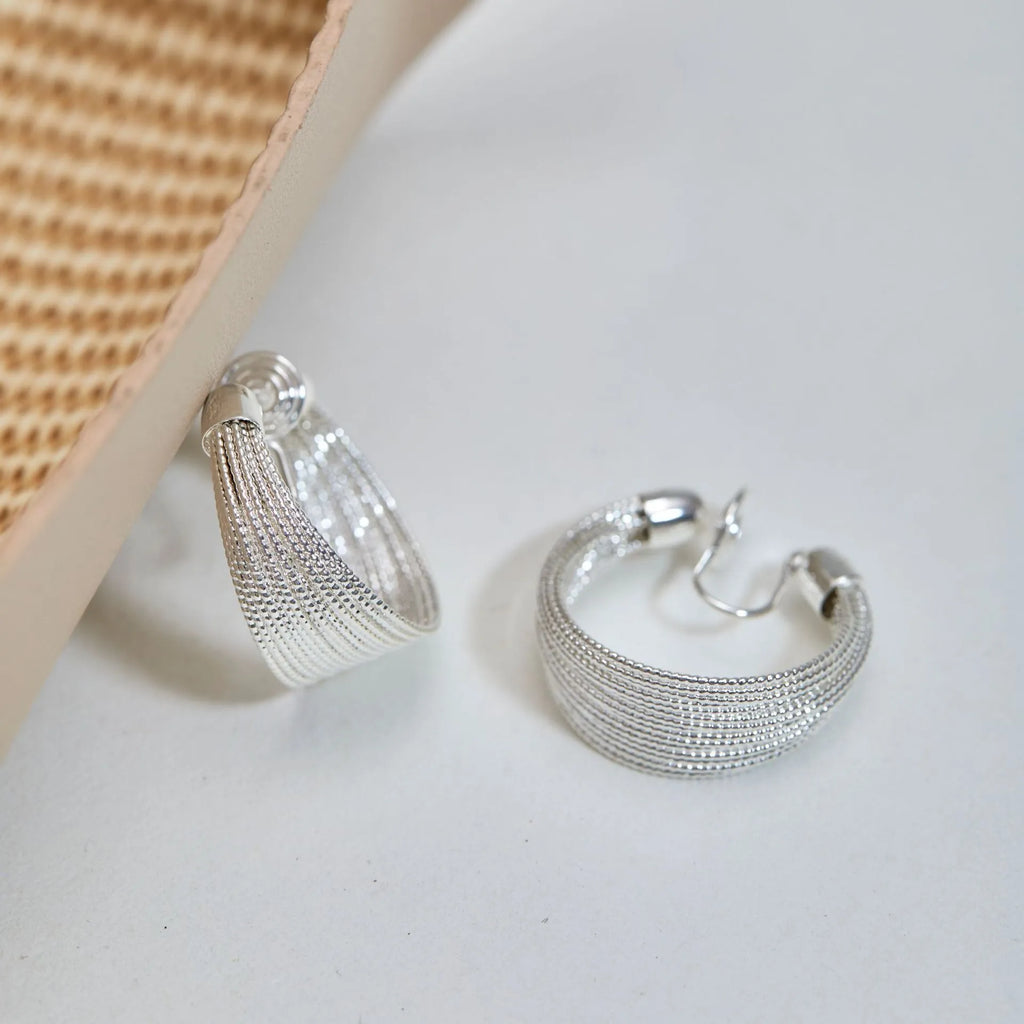 Multi-layer geometric bracelet earrings in gold and silver colour options as studs and clips