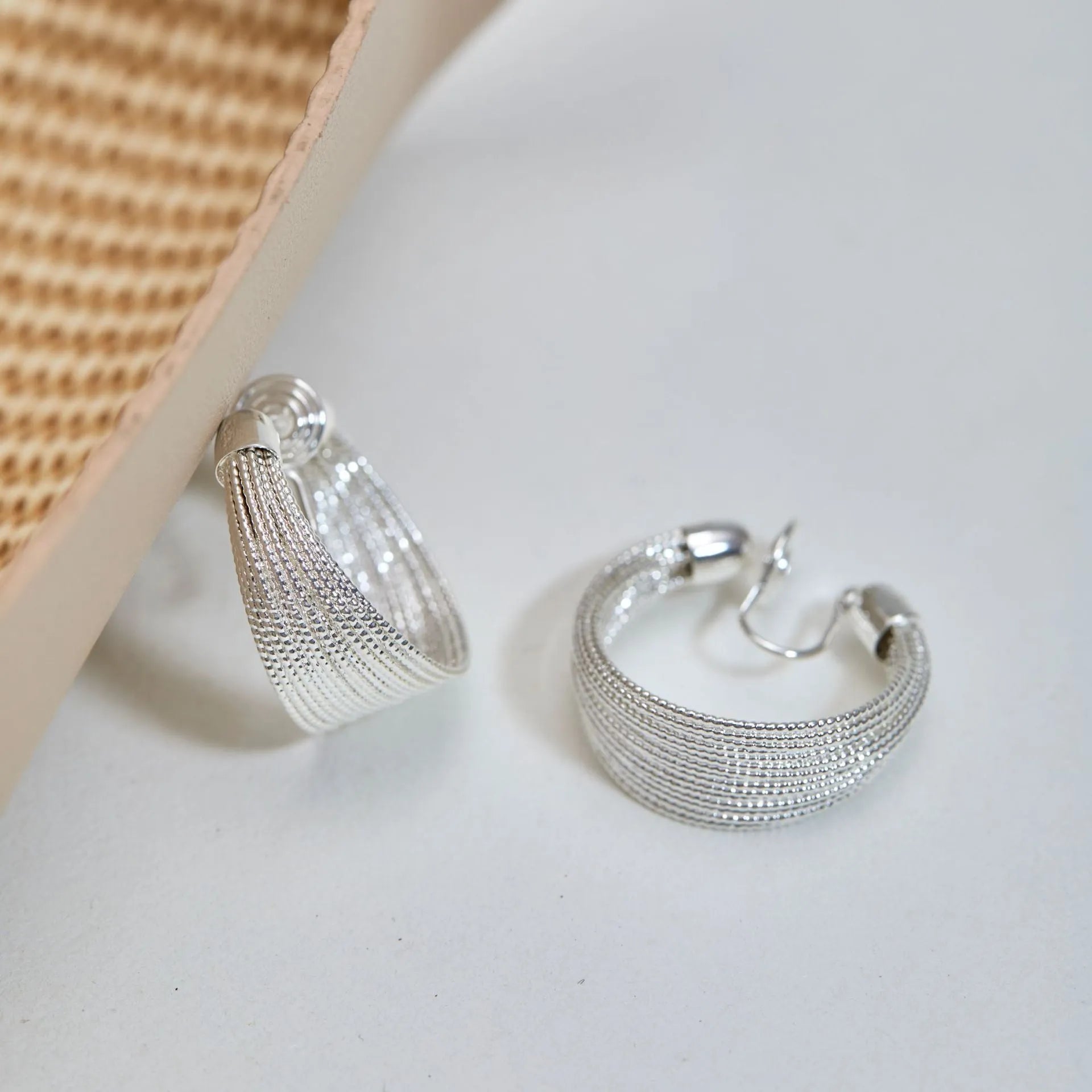Multi-layer geometric bracelet earrings in gold and silver colour options as studs and clips
