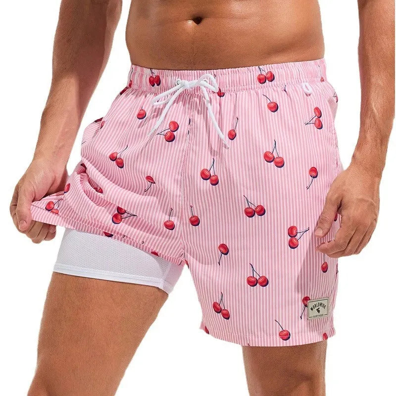 Men's loose swimming trunks with elastic waistband in multiple colour patterns including floral and aquatic designs