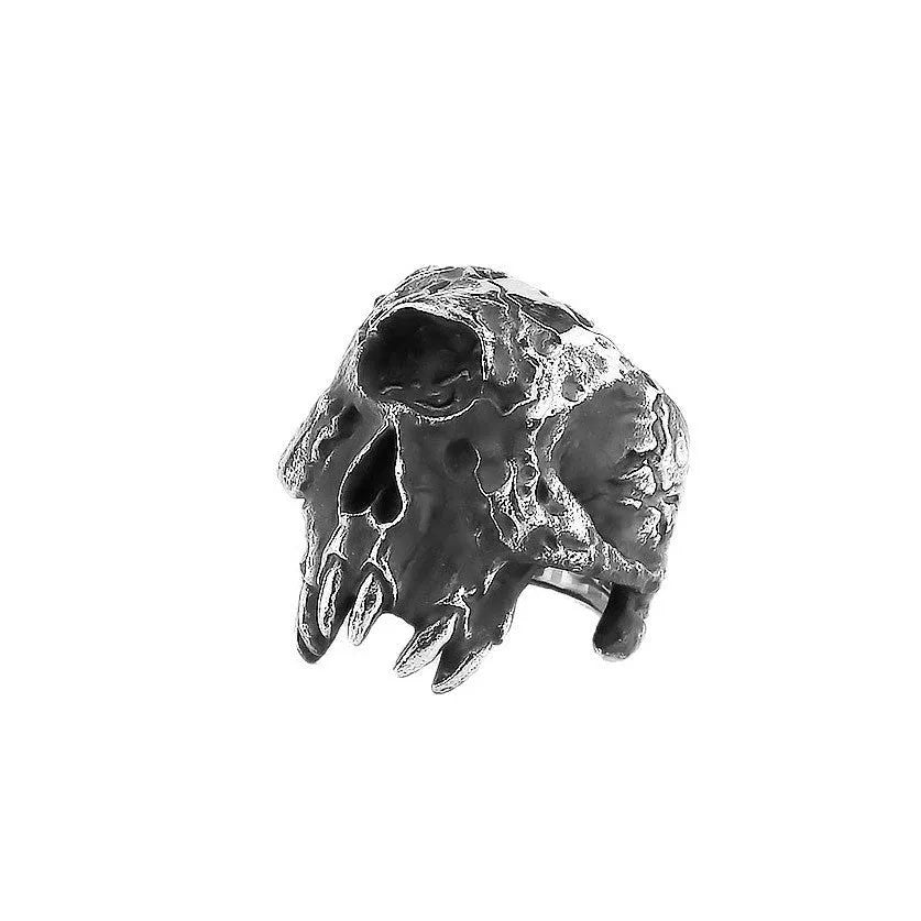 Alloy skull ring with one-eyed design in electroplated finish shown on finger