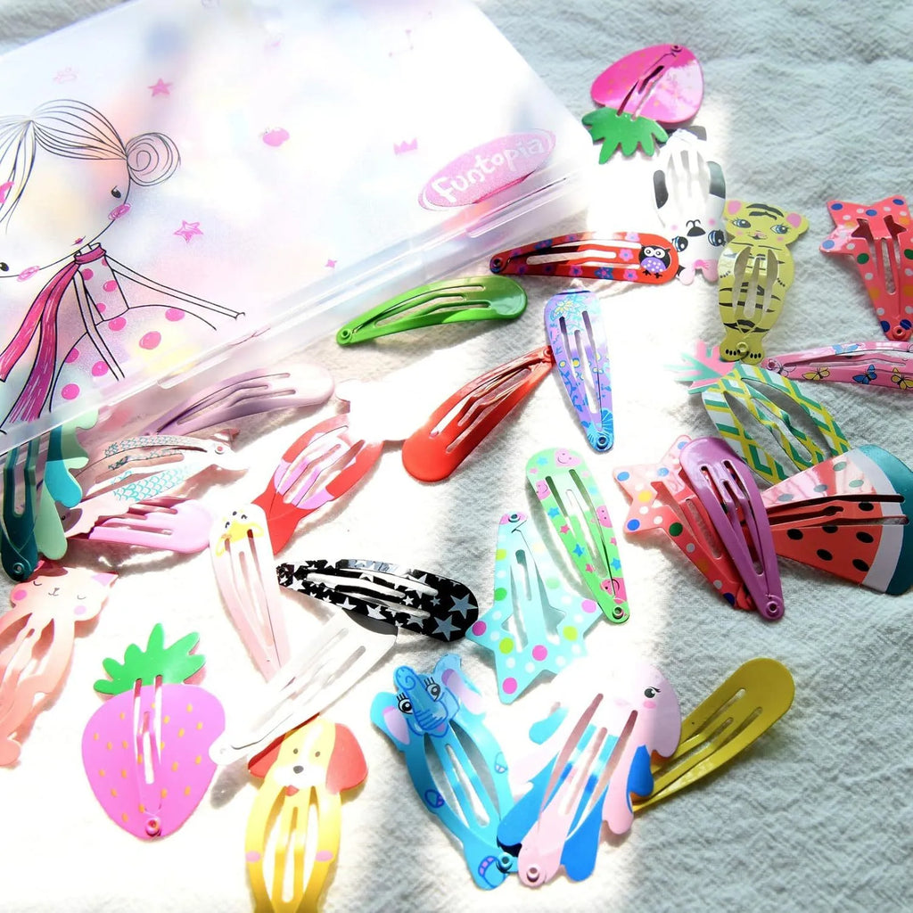 Assortment of 100 metal snap hair clips in candy colours with cartoon designs of animals, fruits, crowns, and stars