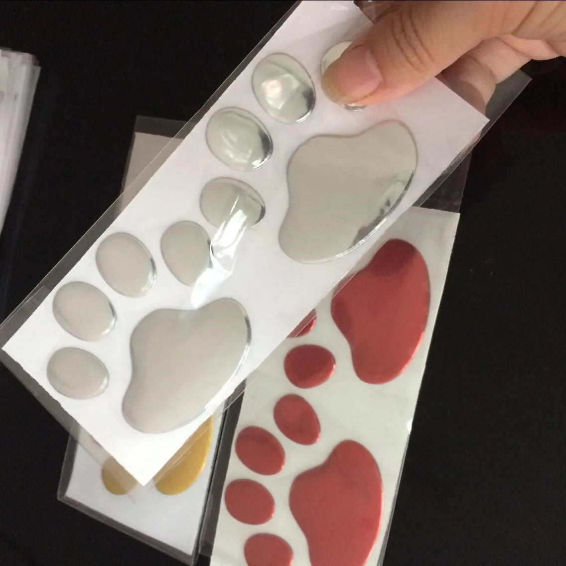 PVC car bumper sticker with hand-shaped brush dog footprint design in four colour options