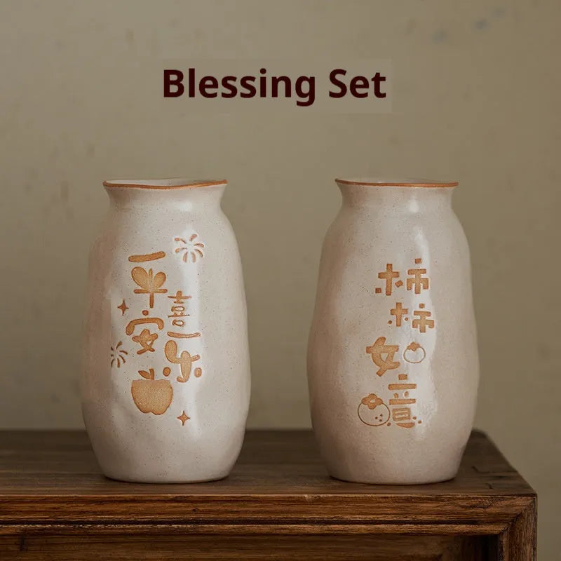 Chinese hand-painted ceramic vase with persimmon fruit designs on wooden desktop
