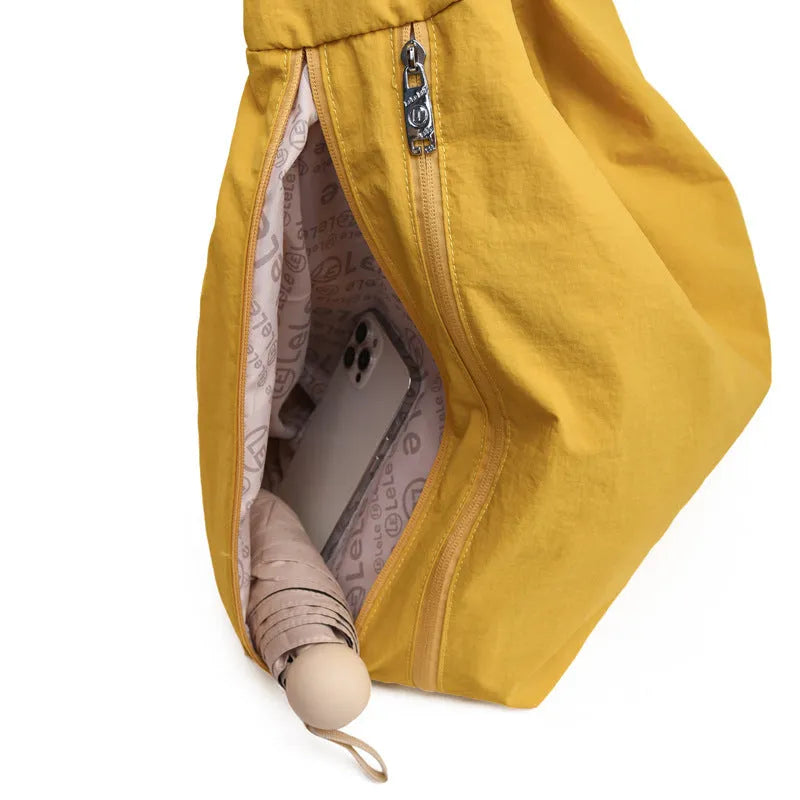 Soft nylon women's underarm bag in a heart shape, shown in black, blue, khaki, and yellow colour options.