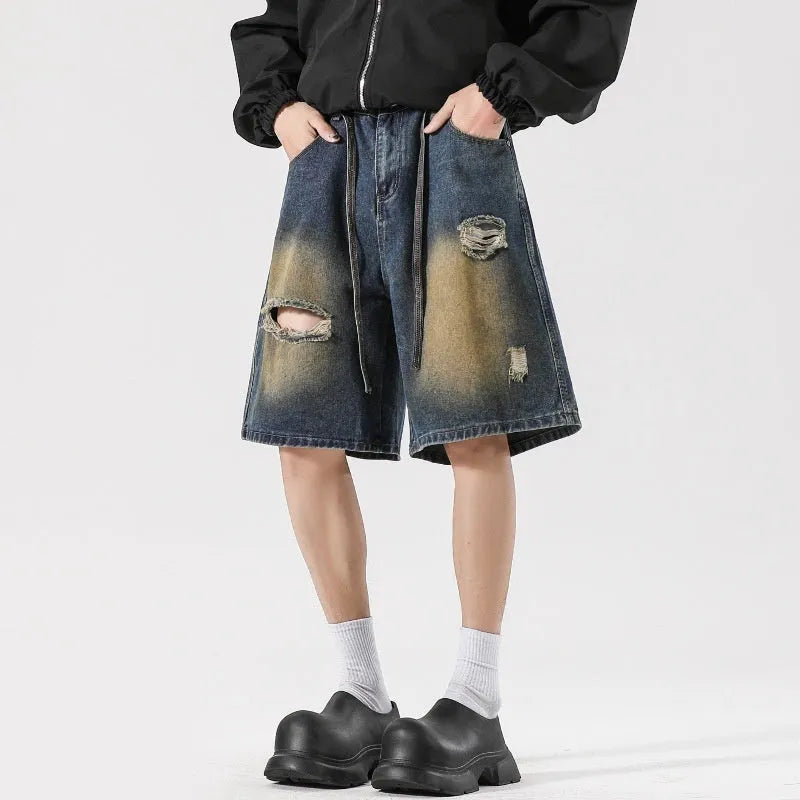 Retro blue loose fit jeans with ripped detailing in cotton denim fabric