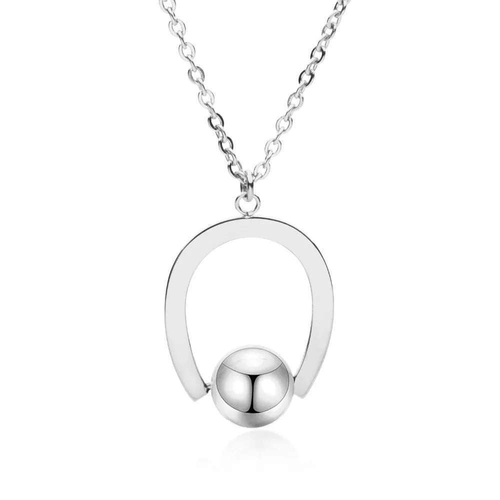 Stainless steel geometric pendant necklace on cross chain in gold or silver finish