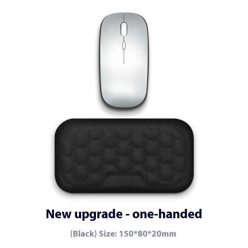 Customisable memory foam mouse wrist pad with black cloth cover on a desk.