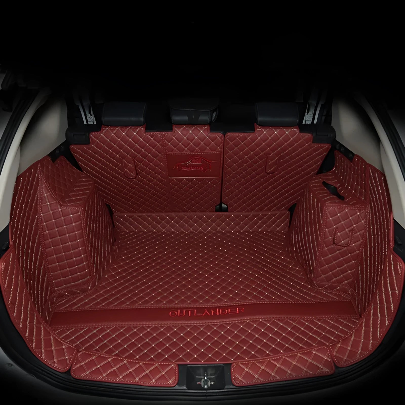 Mitsubishi Outlander custom boot liner with 3D raised edges and non-slip surface in a vehicle boot.