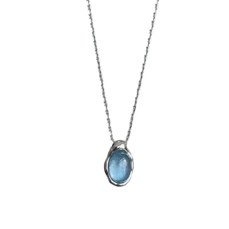 Navy blue water drop pendant necklace with geometric copper design on cross chain
