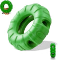 Blue rubber tire-shaped dog chew toy with oval openings, shown as a puzzle feeder for medium to large dogs.