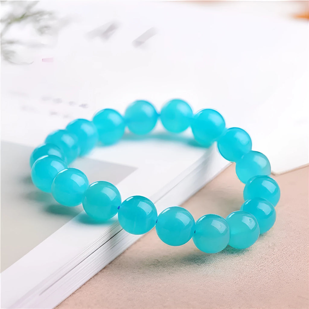 Natural 7A grade ice blue amazonite beads on a string, showing polished surfaces and varying sizes.