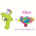 Green interactive cat toy launcher with three white foam discs on a carpet.
