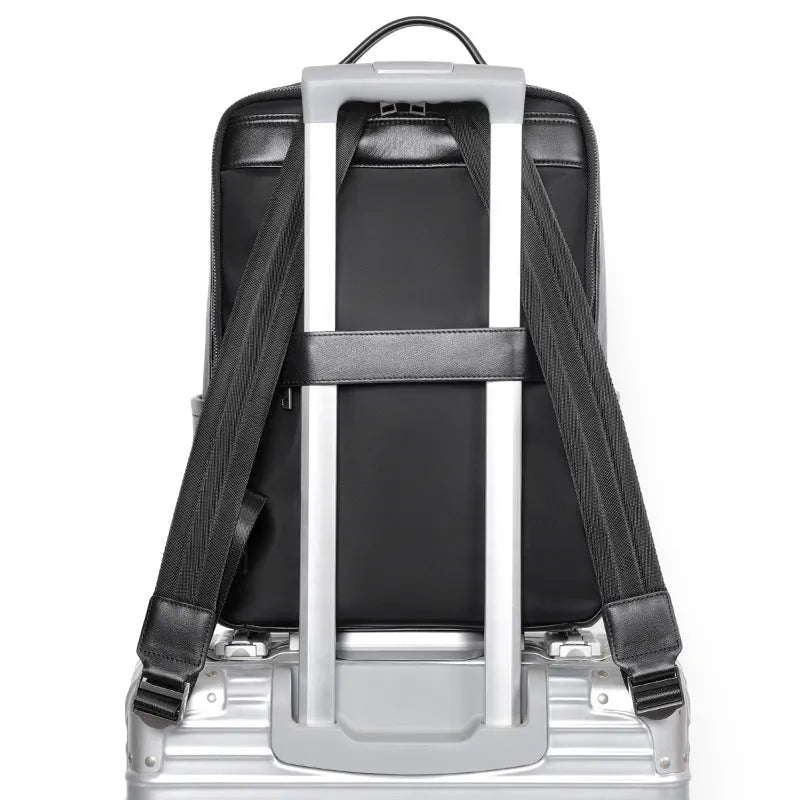 Black genuine leather men's computer backpack with a 36-55L capacity and contoured back plate.