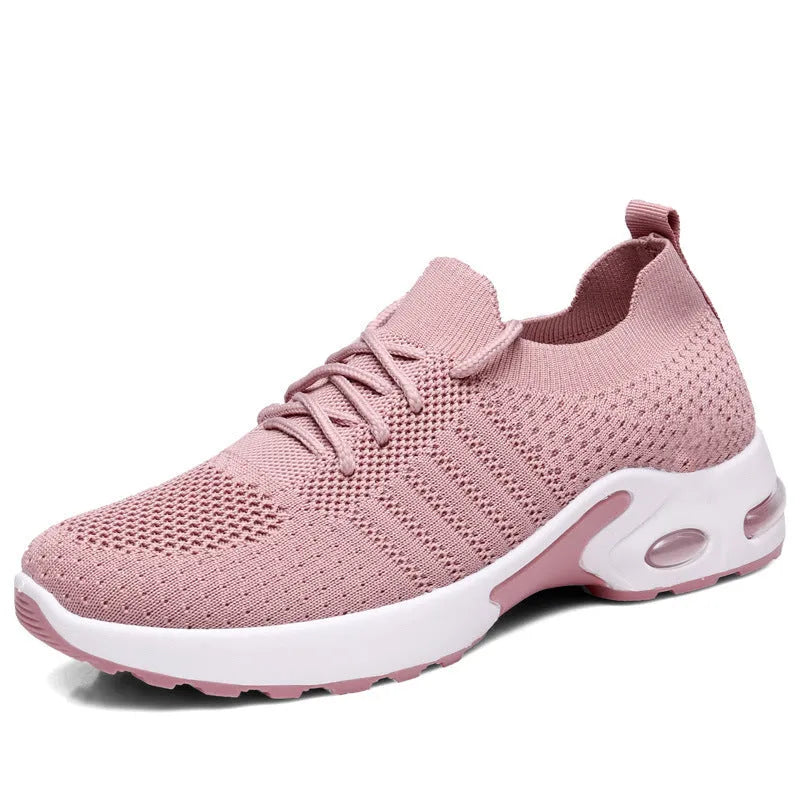 Women's black casual sneakers with mesh upper and non-slip PVC soles, shown with lace-up front closure