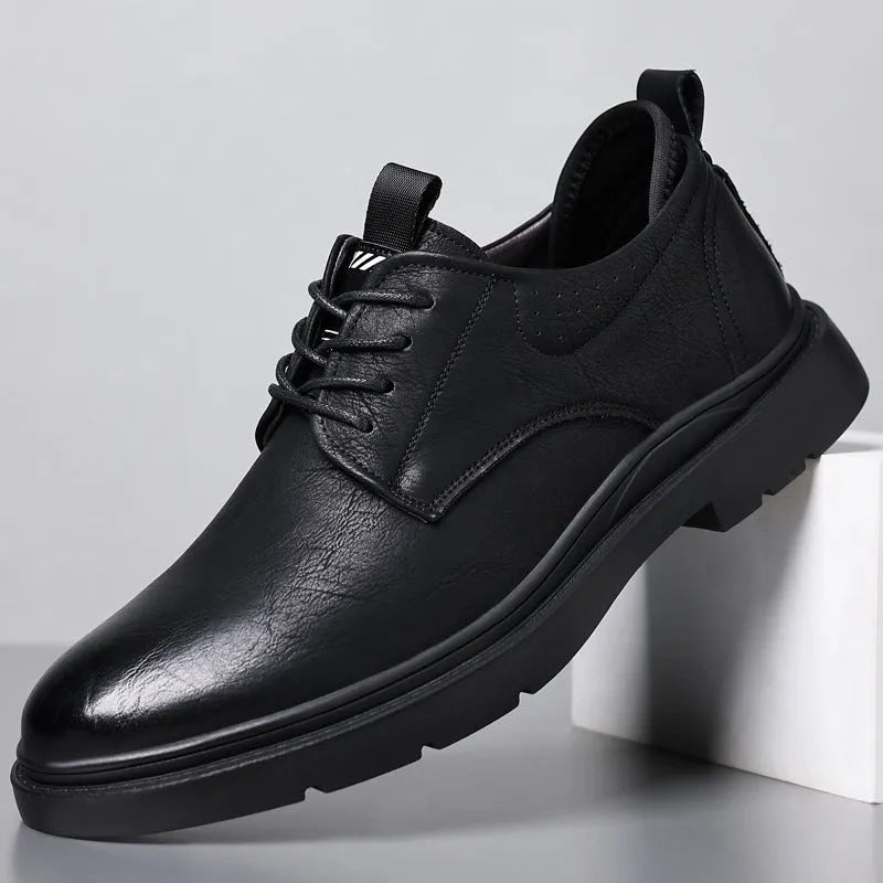 Men's black and brown leather sneakers with cowhide uppers and rubber soles