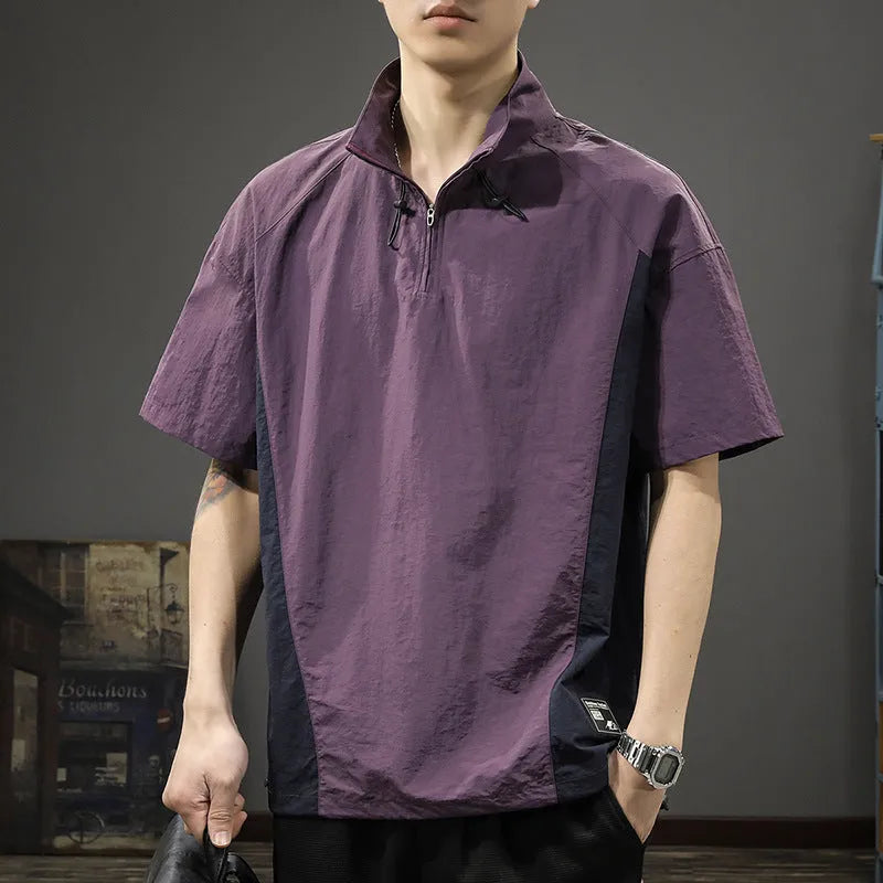 Brown men's half-zip stand collar short sleeve casual shirt laid flat, showing fleece lining and loose fit.