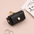 Solid colour hard leather ring storage bag in Korean style, 57x25x35mm, holding a ring