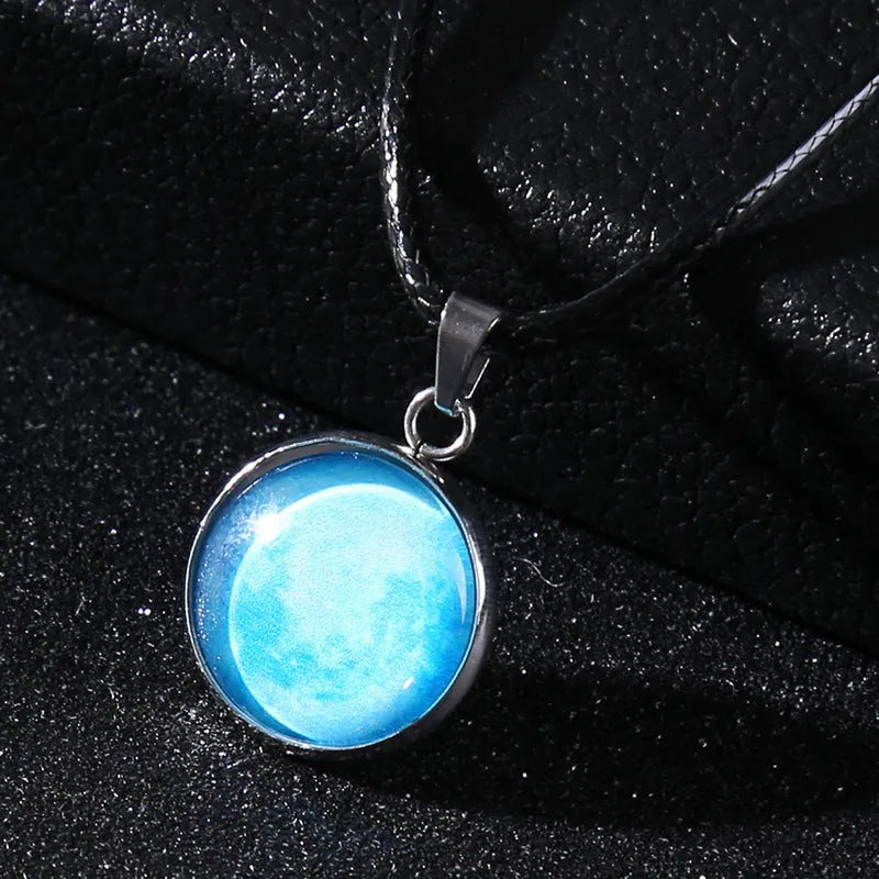Luminous moon and constellation design pendant on an alloy necklace chain with extension.