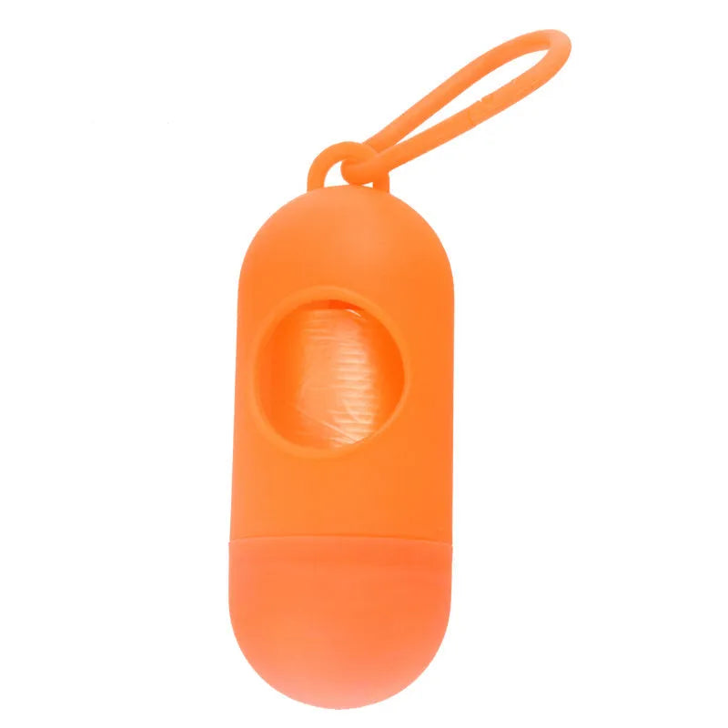 Compact black dog waste bag holder with side hook and velcro base for attaching to trousers or dog collars