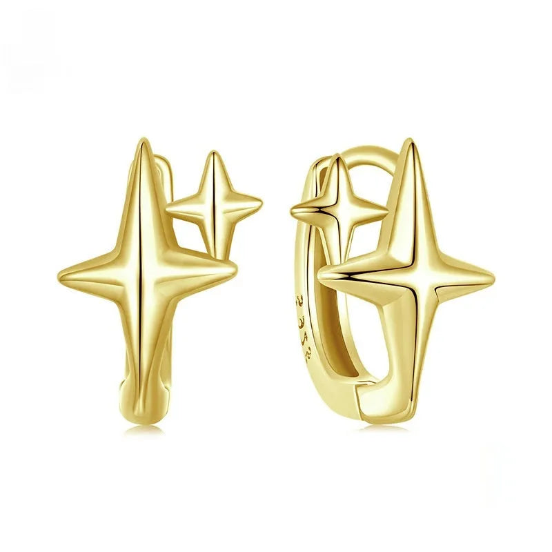 Minimalist star design ear clips in sterling silver with oxidised finish and XINGX elements