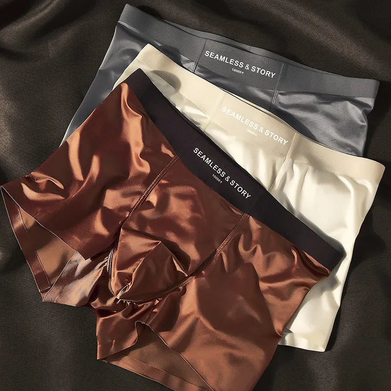 Men's light gray Ice Silk mid-waist underwear briefs laid flat.