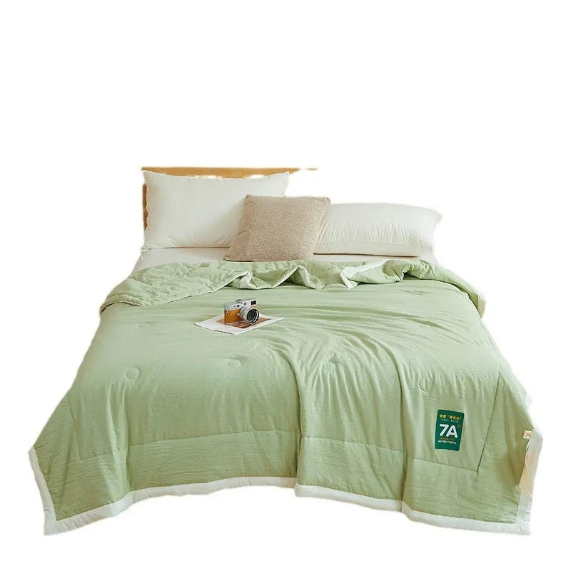 Antibacterial raw cotton washable summer cool quilt in Haze Blue colour, showing quilted pattern and fabric texture