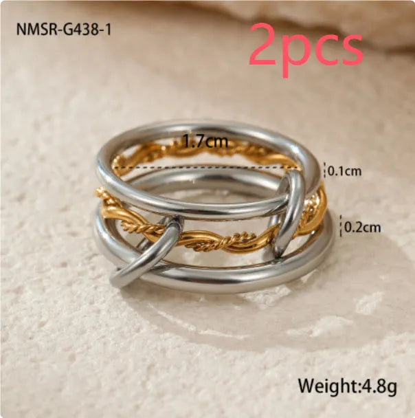 Stacked colour matching stainless steel ring set with 18K gold plating and exaggerated profile