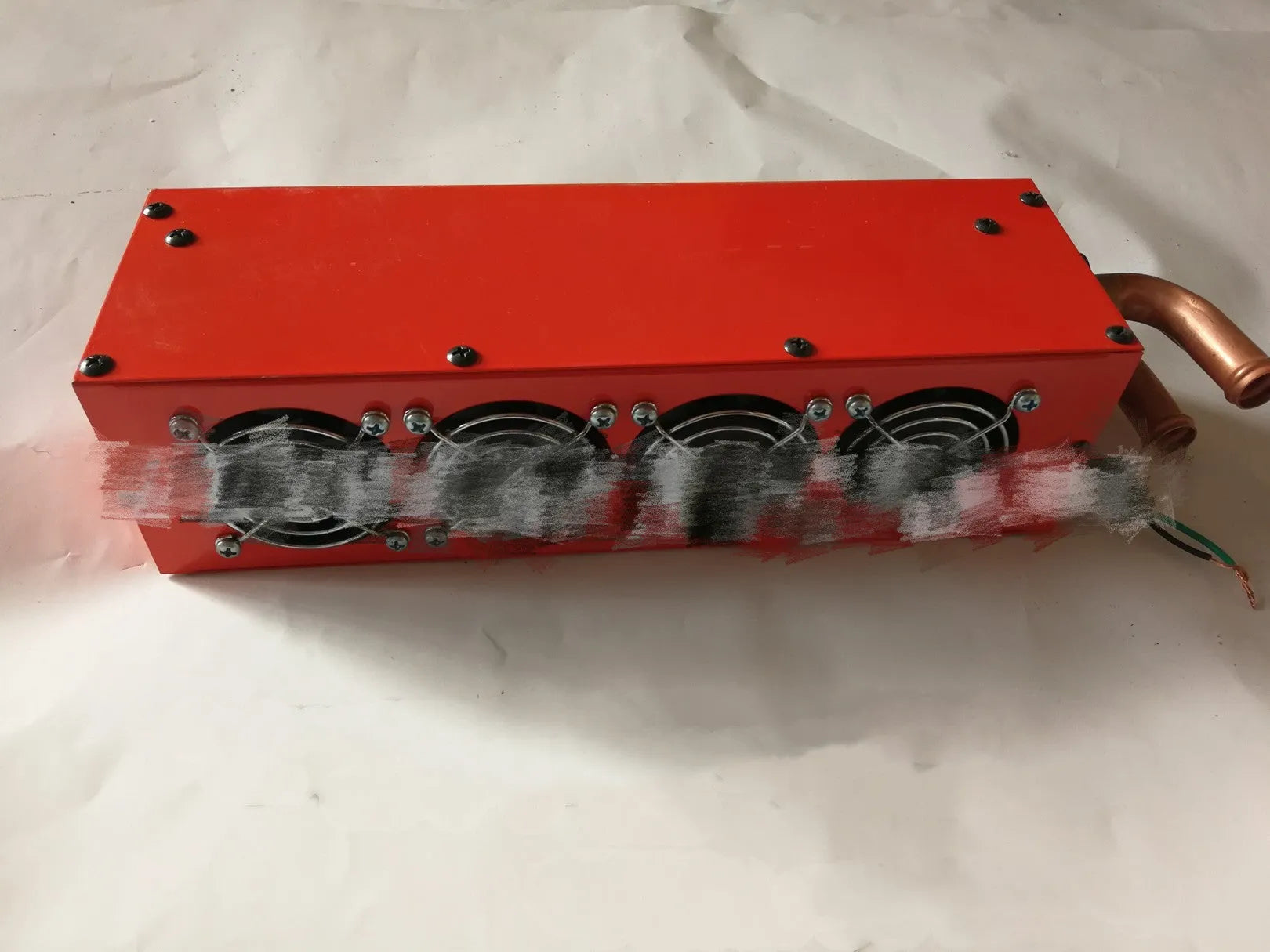 Metal car heater unit with four small copper pipe connectors for 12V/24V vehicle installation.