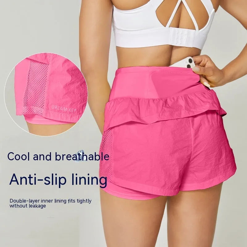 Women's loose casual cotton blend quick-drying sports shorts in multiple colours on a hanger.