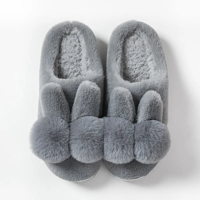 Women's high-top rabbit fur slippers in creamy white colour with floral detail.