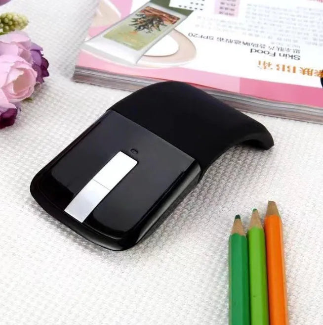 Folding Bluetooth wireless mouse shown in both open and closed positions with compact 131.2mm design