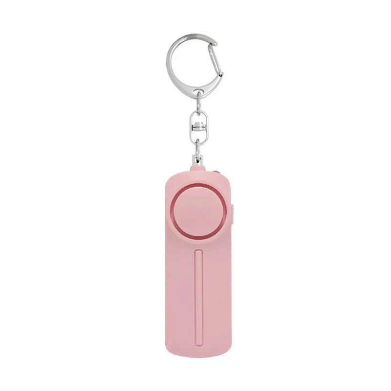Personal safety alarm device measuring 86×30×20 mm with 130 dB sound output in pink colour option