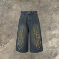 Men's black denim shorts with flame embroidery and patchwork design, straight leg cut