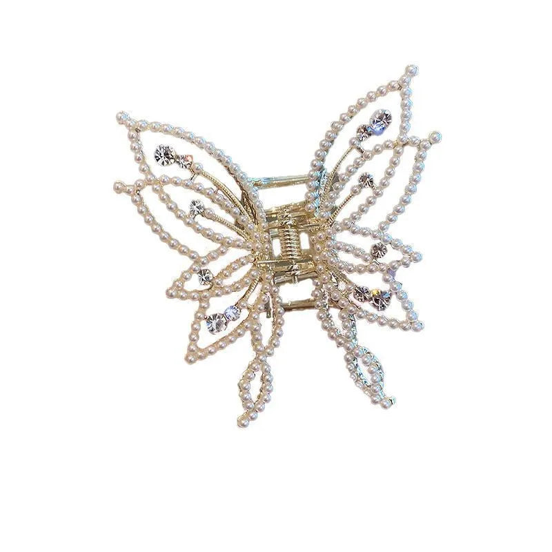 Butterfly-shaped alloy hair clip for women, shown in rhinestone and pearl style options